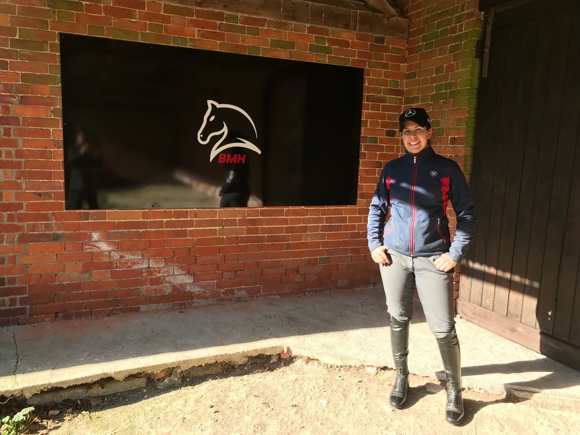 Bianca outside the stables with BMH branding